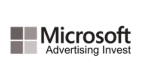 A grey logo of Microsoft Advertising Invest.