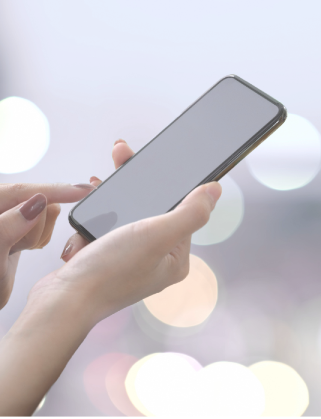 female hands holding a mobile phone, representing a full view ads product
