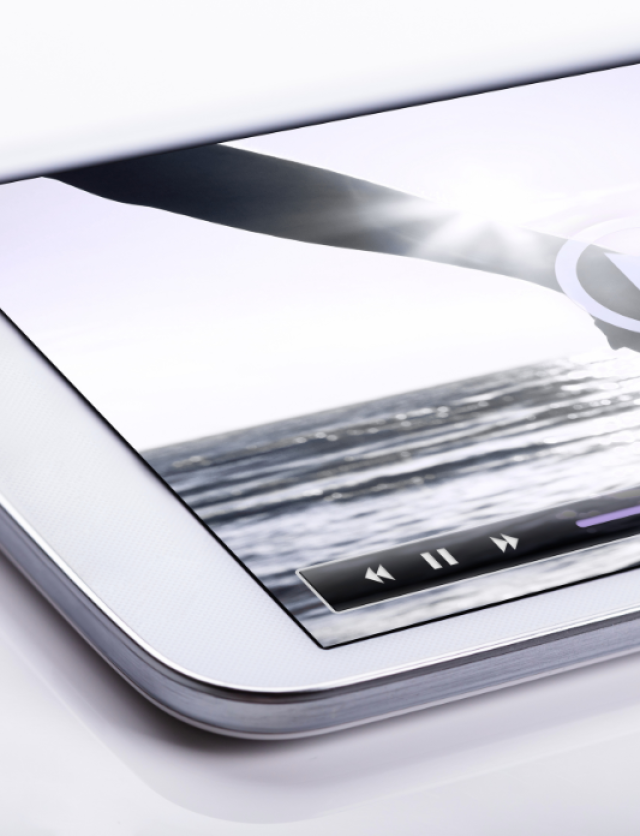 a mobile phone with a paused video on the full screen, representing a premium video product.