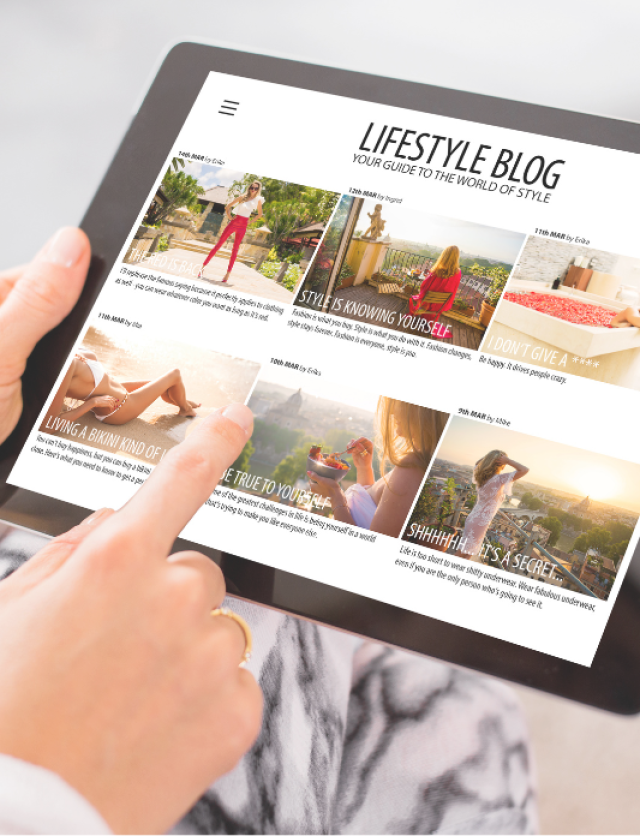 hands browsing a lifestyle blog on tablet.